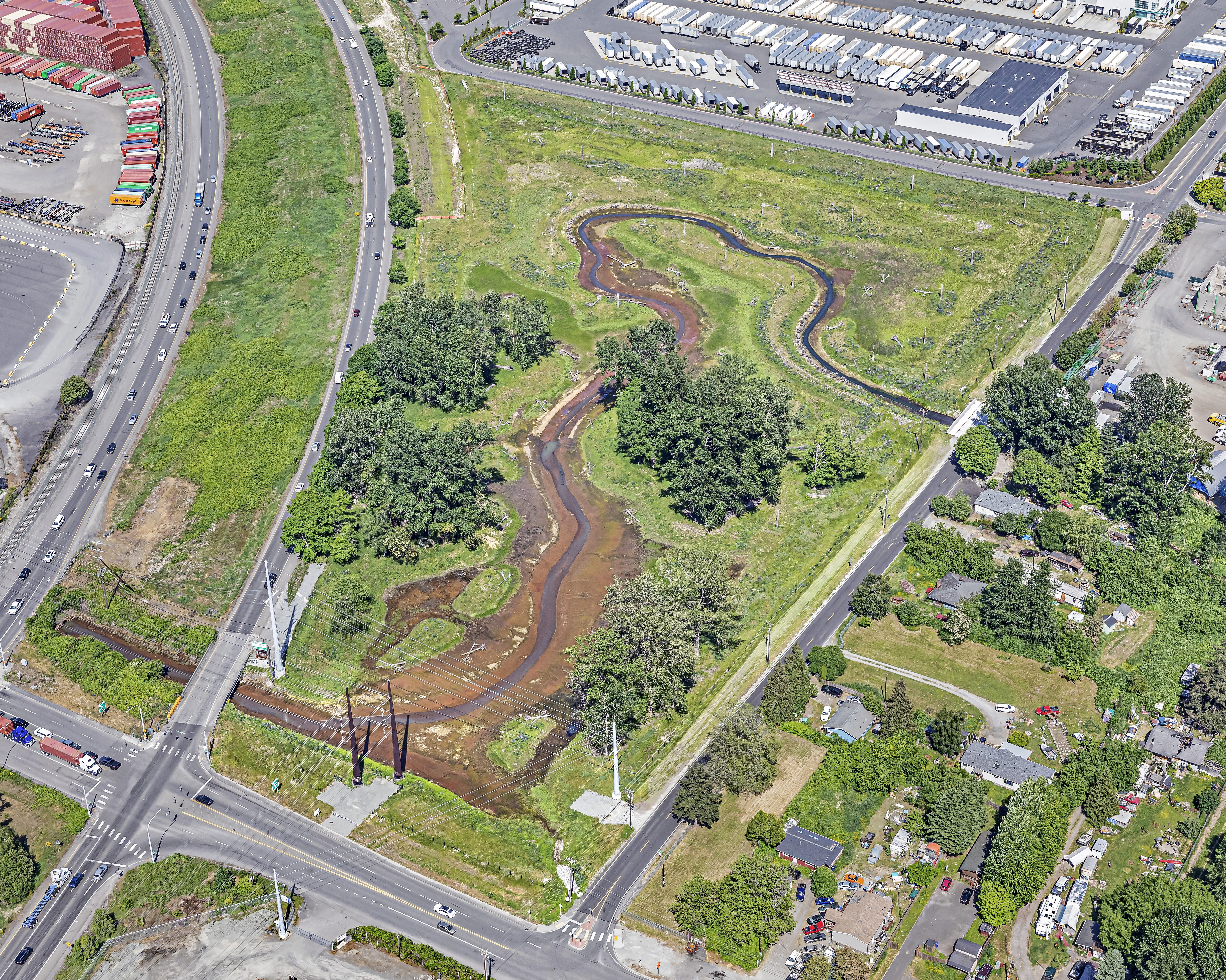 Bird's eye view of the Lower Wapato site after project completion shows the restored channel meandering between preserved tree stands